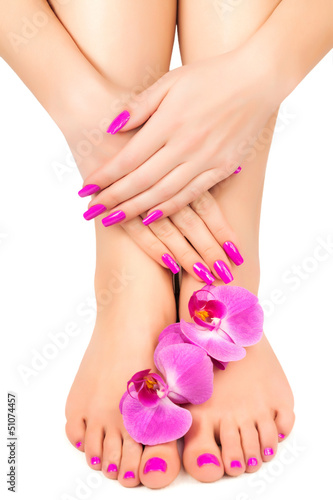 pink manicure and pedicure with a orchid flower
