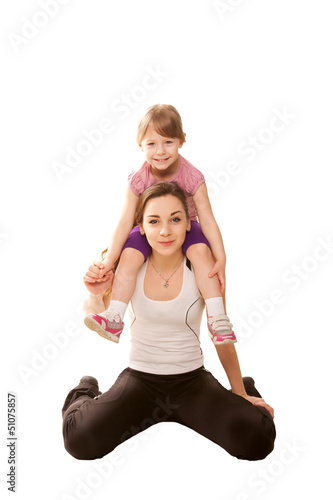 Two sisters in sportswear, teen and little girl.