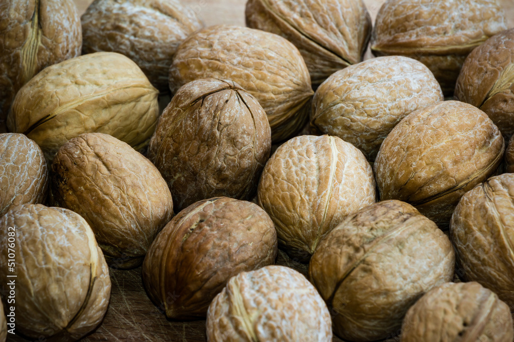 Closeup of Walnuts on a Wooden Board Closeup of Walnuts on a Wooden Board