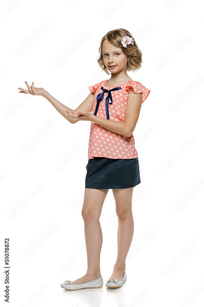 Little girl showing blank copy space, over white Little girl showing blank copy space, over white
