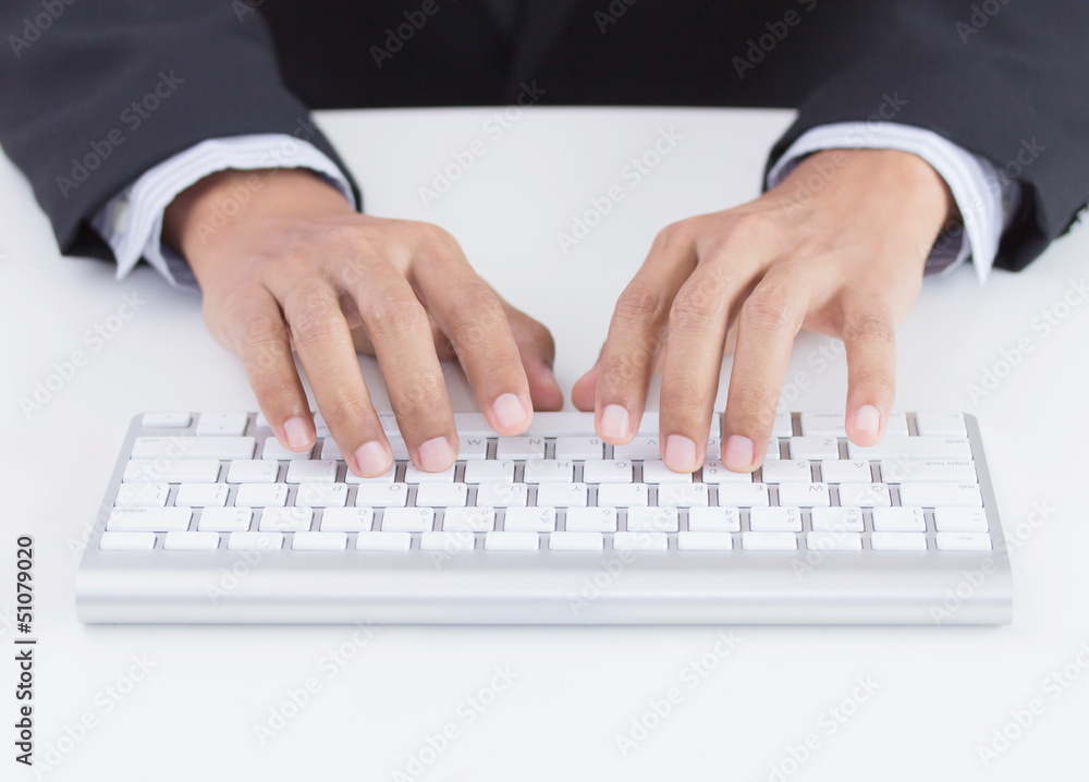 Business hands typing on keyboard in office Business hands typing on keyboard in office