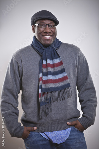 Portrait of a happy African American man with hands in pockets