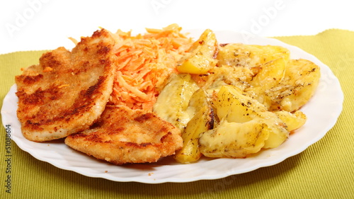 Fried chicken roasted potatos and carrot salad © Voyagerix