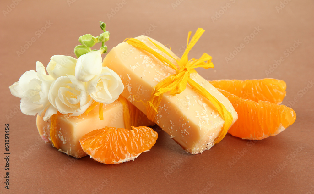 Natural fruit handmade soap, on brown background Natural fruit handmade soap, on brown background