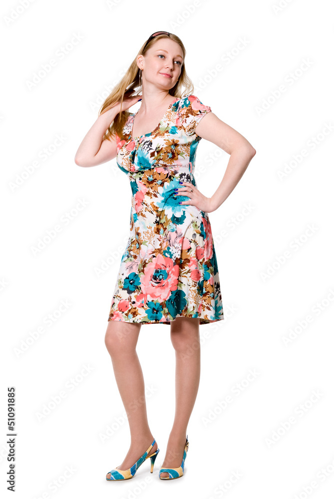 Beautiful girl in full growth in a flowered dress Beautiful girl in full growth in a flowered dress