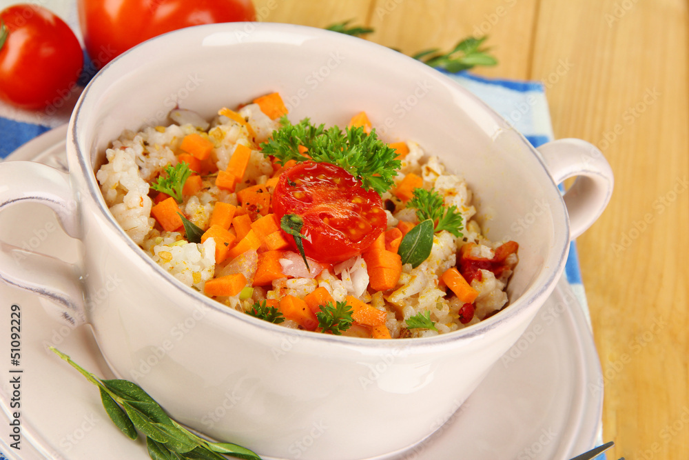 Delicious rice with vegetables and herbs in pot Delicious rice with vegetables and herbs in pot