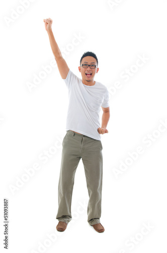 chinese male celebrating in success standing with funny expressi