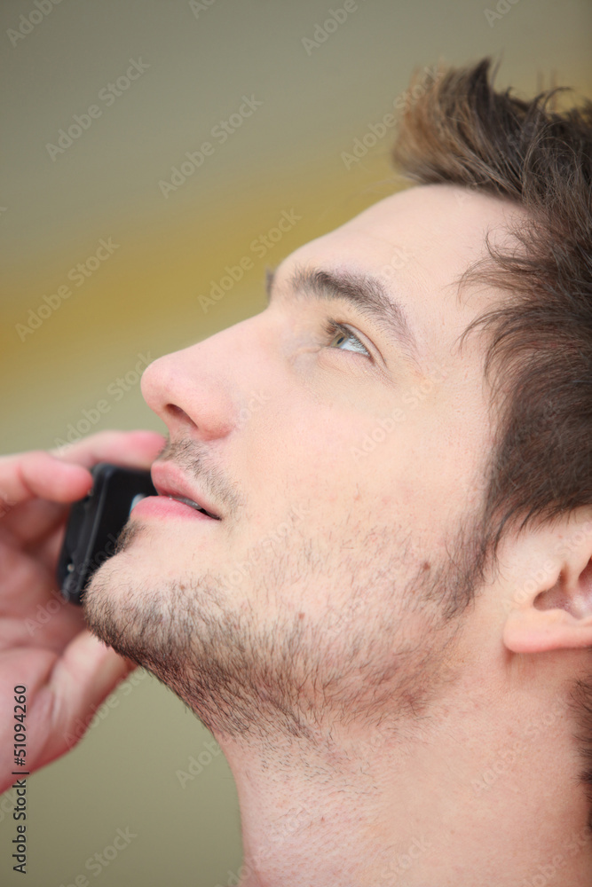 Close-up of man on mobile telephone