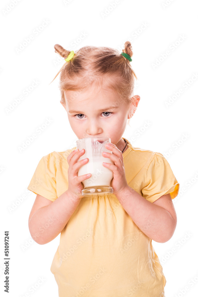 Beautiful little girl holding a glass of fresh milk. Beautiful little girl holding a glass of fresh milk.