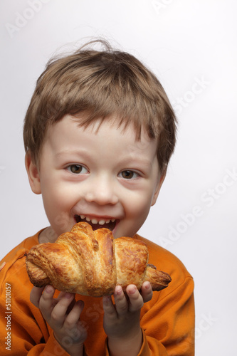happy boy with  croissant