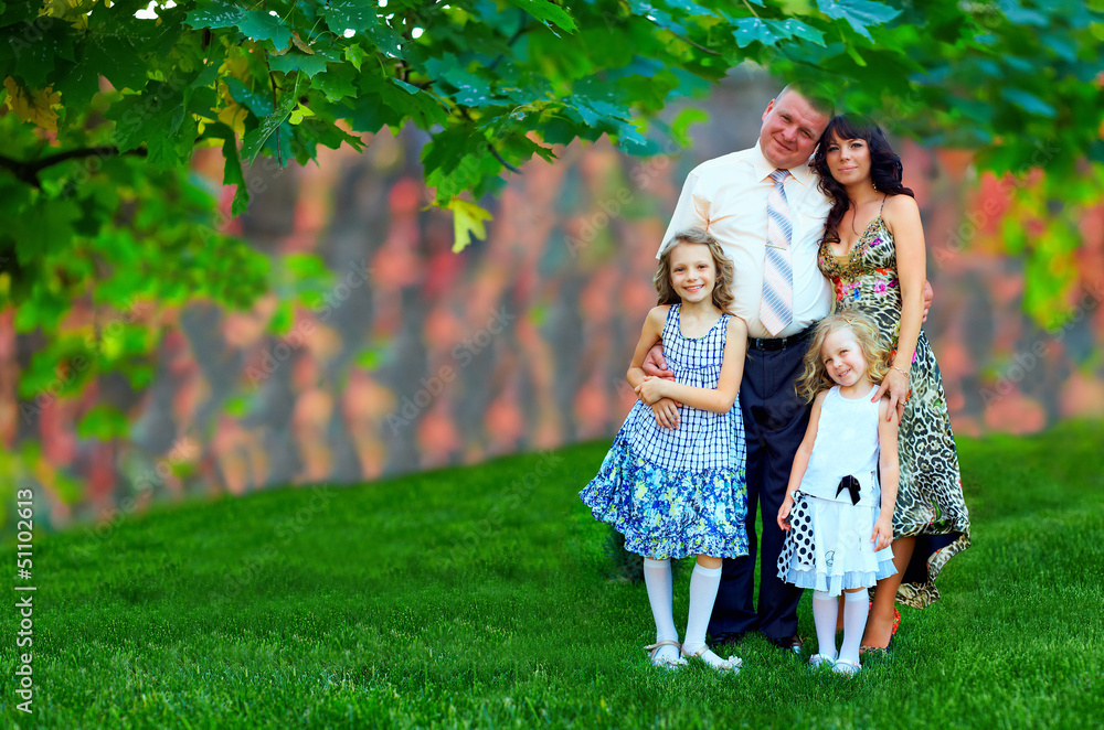 Fototapeta premium beautiful family portrait, colorful outdoors