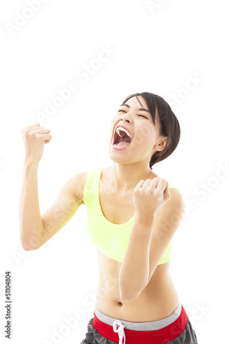 young woman doing her workout with success gesture