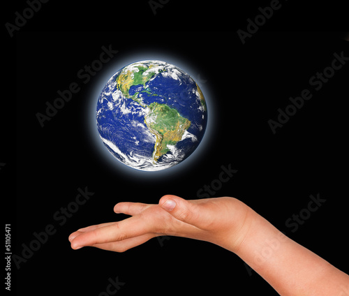 Planet earth in hand.Elements of this image furnished by NASA