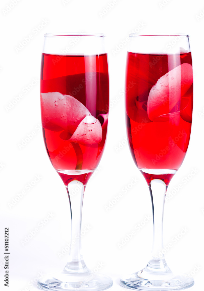 glass with red wine and an orchid glass with red wine and an orchid