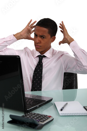 young black businessman looking exasperated photo