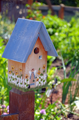 Decorative wooden birdhouse © perlphoto