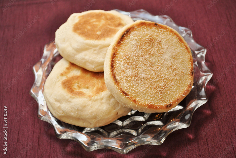 English Muffins Over a Maroon Background English Muffins Over a Maroon Background