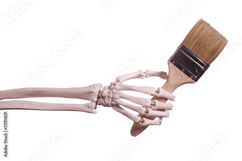 skeleton hand holding paint brush