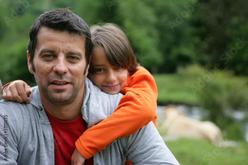 Child hugging father