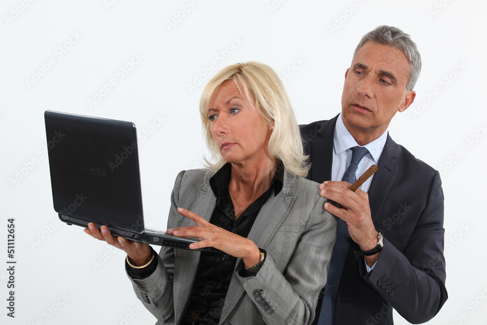 business people analyzing information on their laptop business people analyzing information on their laptop