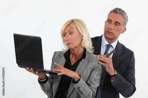business people analyzing information on their laptop