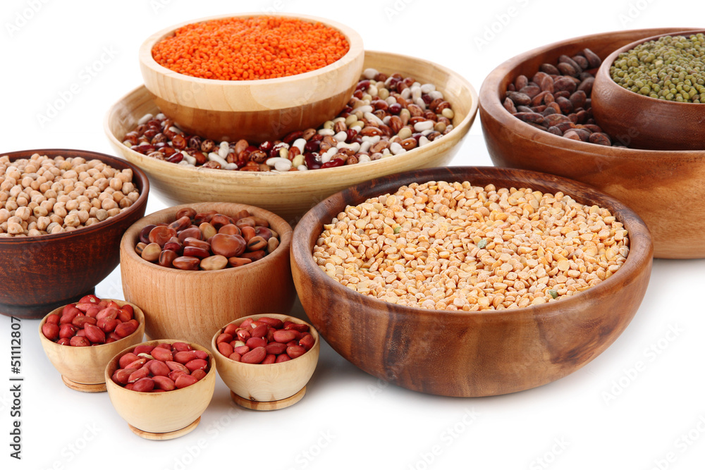 Different kinds of beans in bowls isolated on white Different kinds of beans in bowls isolated on white
