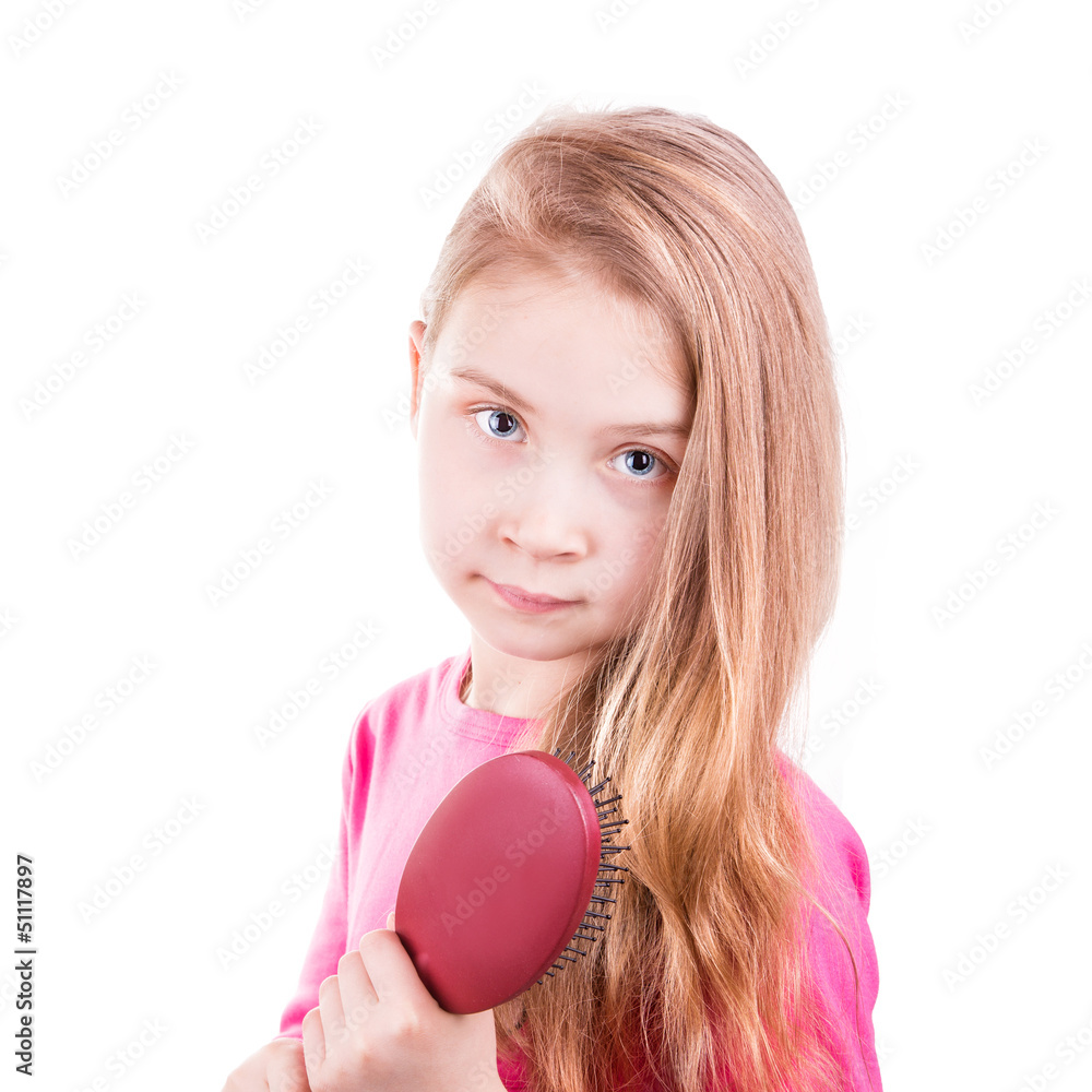 Beautiful little girl brushing her long hair. Beautiful little girl brushing her long hair.