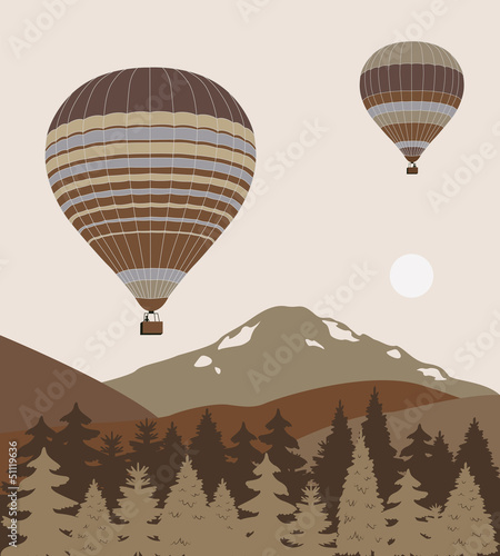 Hot air ballons over the mountains.