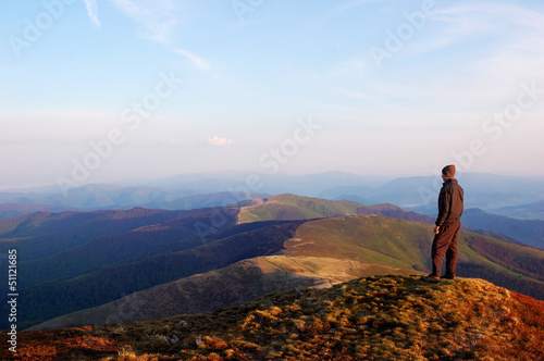 Man standing on top of a mountain