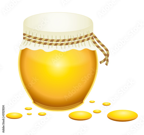 Honey jar with honey droplets.
