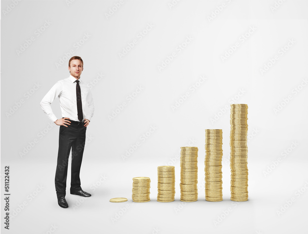 Businessman and increasing columns of gold coins Businessman and increasing columns of gold coins