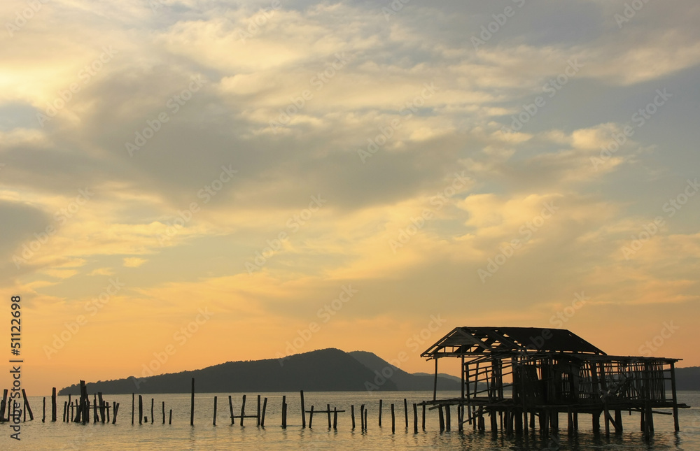 Silhouette of old wooden jetty at sunrise, Koh Rong island, Camb Silhouette of old wooden jetty at sunrise, Koh Rong island, Camb