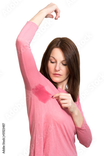 Woman sweating very badly under armpit