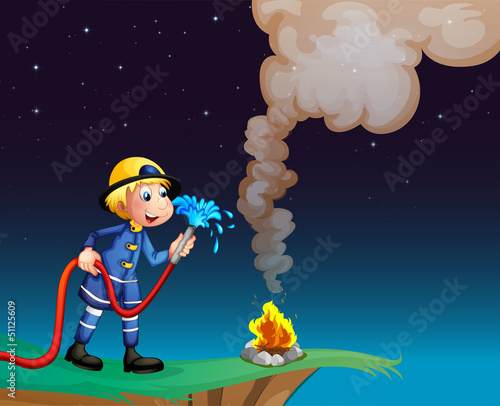 A fireman holding a water hose