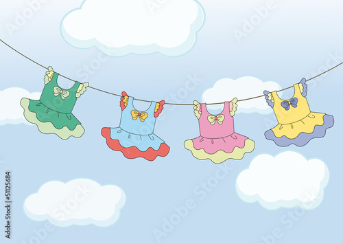 Four hanging dresses