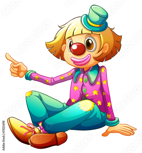 A clown sitting while pointing