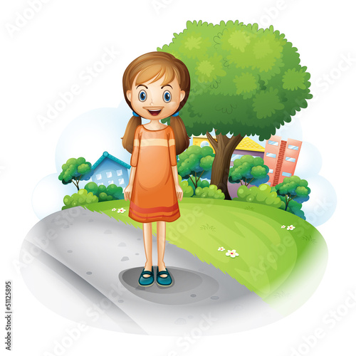 A girl standing in the middle of the street