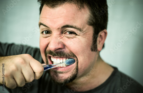 Man washing his teeth