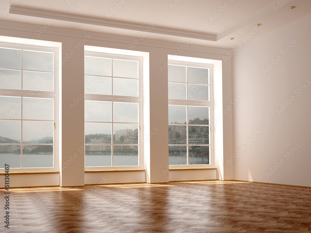 A spacious room with three large windows A spacious room with three large windows