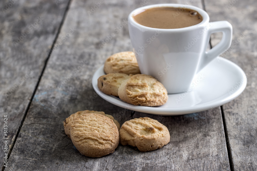 coffee cup and cookies on table coffee cup and cookies on table
