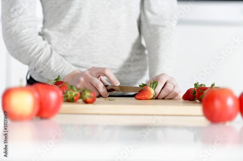 Woman cutting up fruit