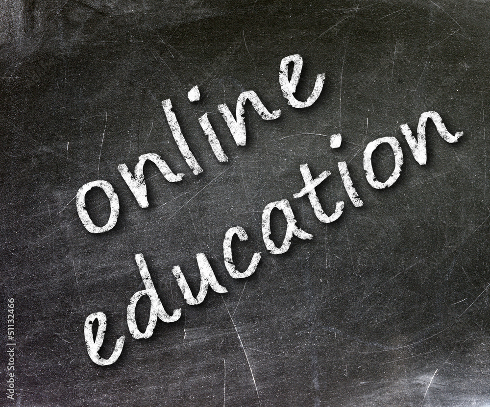 Fototapeta premium Online education school written on a chalkboard