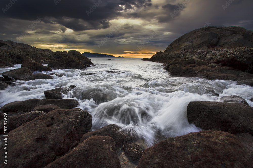 Sea waves lash line impact rock on the beach Sea waves lash line impact rock on the beach