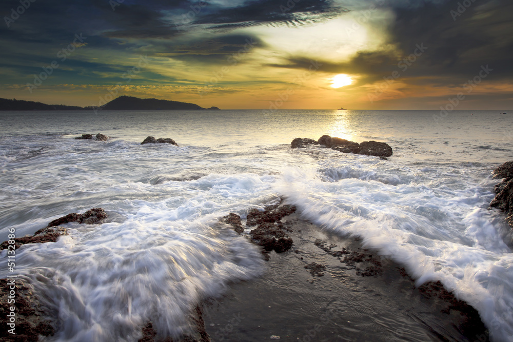 Sea waves lash line impact rock on the beach Sea waves lash line impact rock on the beach