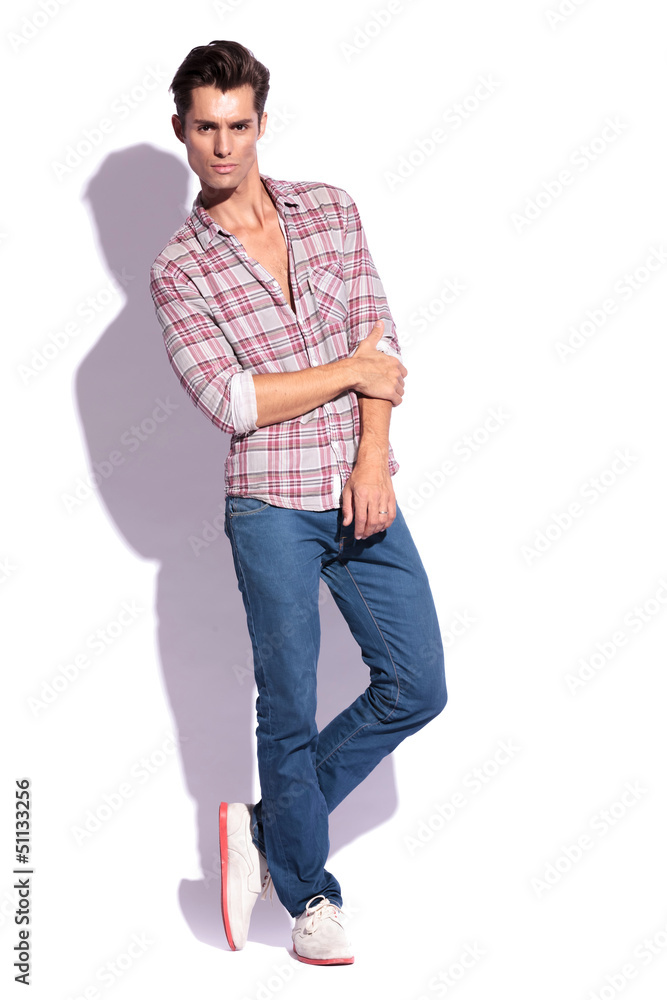 man holds hand with legs crossed man holds hand with legs crossed