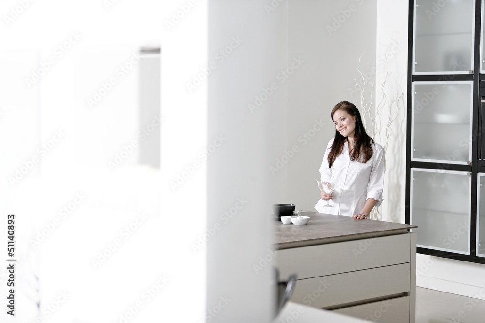 Woman in her stylish kitchen Woman in her stylish kitchen
