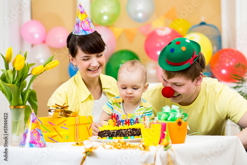 family celebrating first bi...