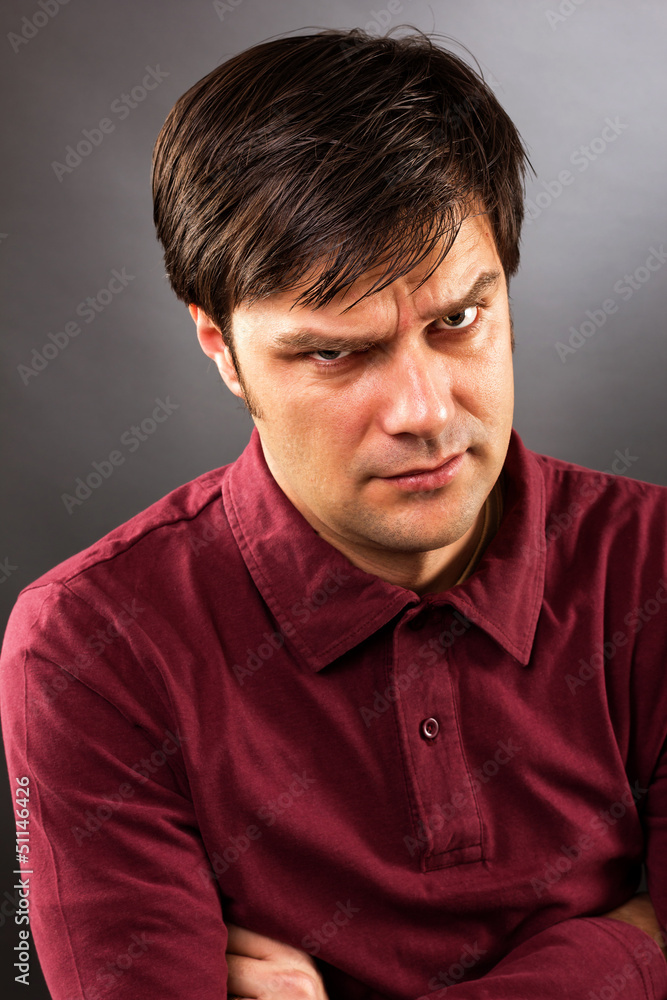 Fototapeta premium Young man with serious expression