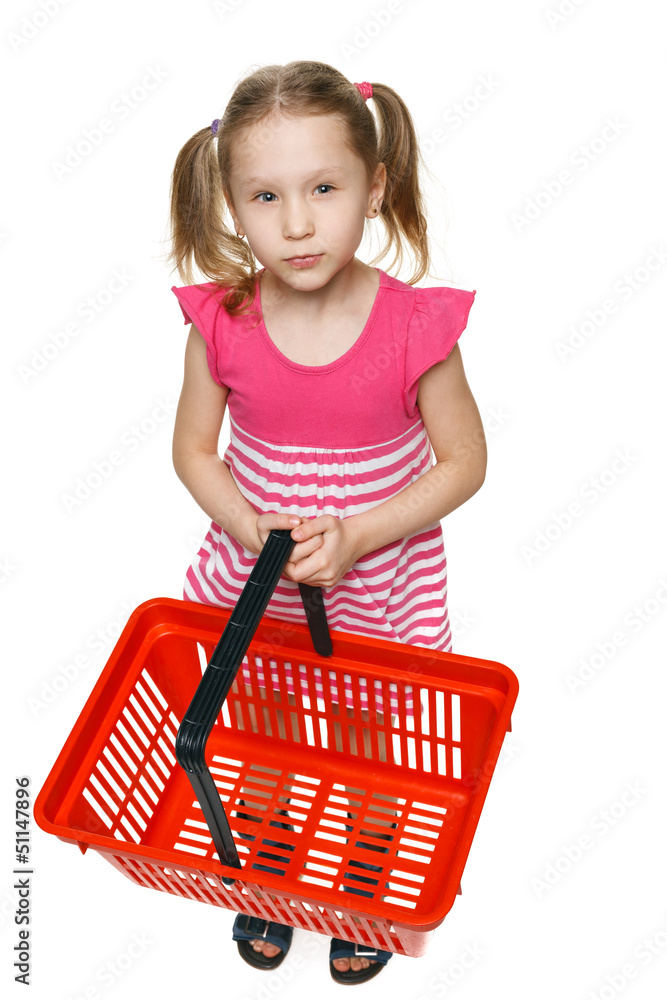 Little girl holding empty shopping basket, thinking what to buy Little girl holding empty shopping basket, thinking what to buy