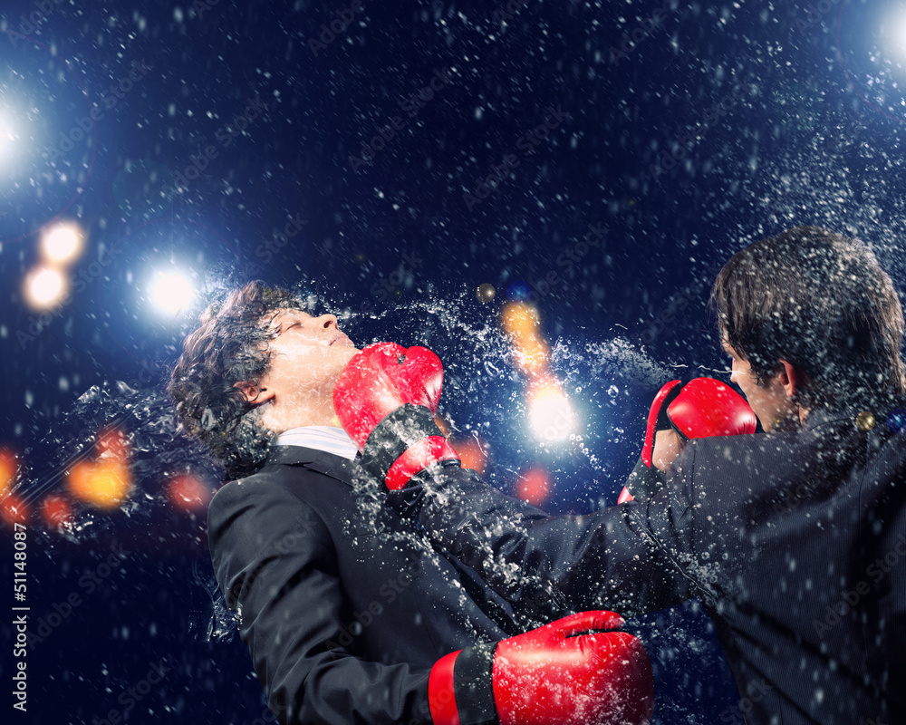Two young businessman boxing Two young businessman boxing